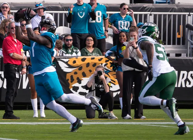 Jacksonville Jaguars running back Travis Etienne Jr. (1) hauls in a pass in the second quarter during an NFL football game at EverBank Stadium, Sunday, Dec. 14, 2025, in Jacksonville, Fla. [Doug Engle/Florida Times-Union]