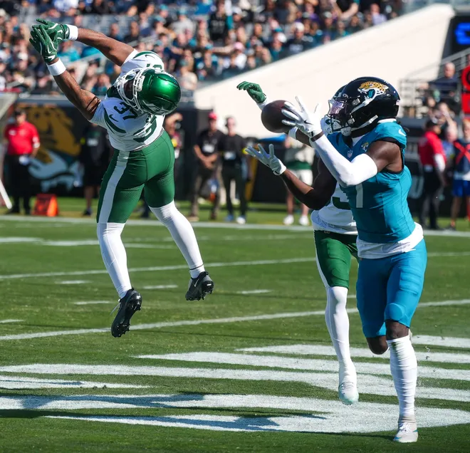 Jacksonville Jaguars wide receiver Brian Thomas Jr. (7) hauls in a pass for a touchdown in the first quarter during an NFL football game at EverBank Stadium, Sunday, Dec. 14, 2025, in Jacksonville, Fla. [Doug Engle/Florida Times-Union]