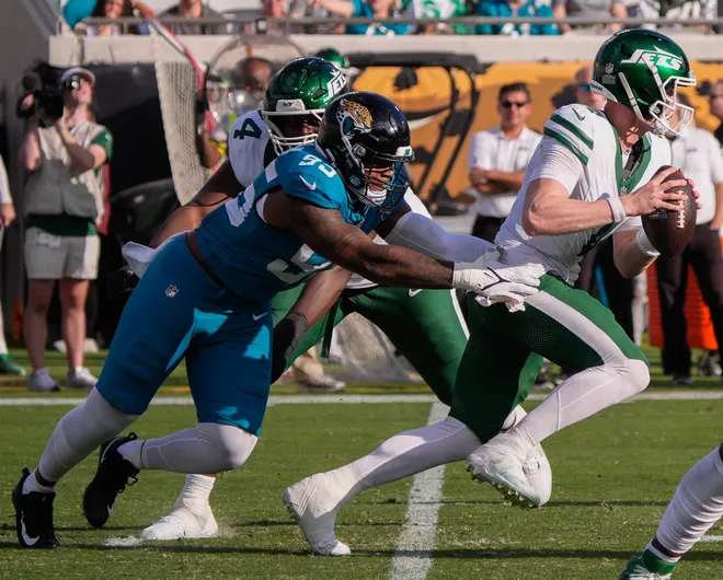 Jacksonville Jaguars defensive end BJ Green II (95) sacks New York Jets quarterback Brady Cook (4) in the third quarter during an NFL football game at EverBank Stadium, Sunday, Dec. 14, 2025, in Jacksonville, Fla. The Jaguars defeated the Jets 48-20. [Doug Engle/Florida Times-Union]