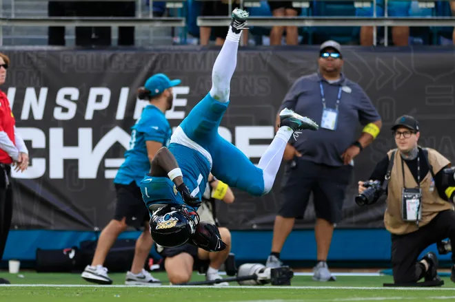 Jacksonville Jaguars running back Travis Etienne Jr. (1) leaps to score a rushing touchdown during the fourth quarter of an NFL football matchup at EverBank Stadium, Sunday, Dec. 14, 2025, in Jacksonville, Fla. The Jaguars defeated the Jets 48-20. [Corey Perrine/Florida Times-Union]