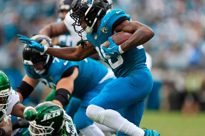 Jacksonville Jaguars running back Lequint Allen Jr. (36) rushes for yards during the fourth quarter of an NFL football matchup at EverBank Stadium, Sunday, Dec. 14, 2025, in Jacksonville, Fla. The Jaguars defeated the Jets 48-20. [Corey Perrine/Florida Times-Union]