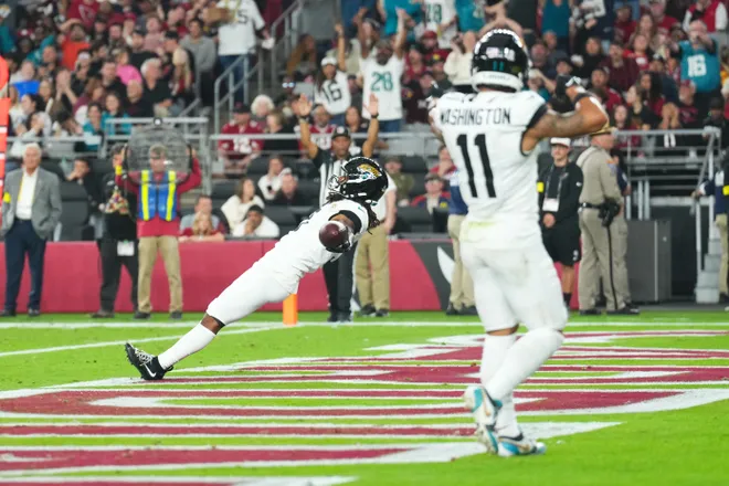 Nov 23, 2025; Glendale, Arizona, USA; Jacksonville Jaguars wide receiver Jakobi Meyers (3) celebrates after scoring a touchdown during the third quarter against the Arizona Cardinals at State Farm Stadium. Mandatory Credit: Joe Camporeale-Imagn Images