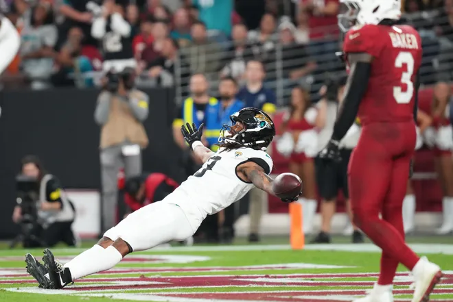 Jacksonville Jaguars receiver Jakobi Meyers (3) celebrates his touchdown reception against the Arizona Cardinals at State Farm Stadium on Nov. 23, 2025.