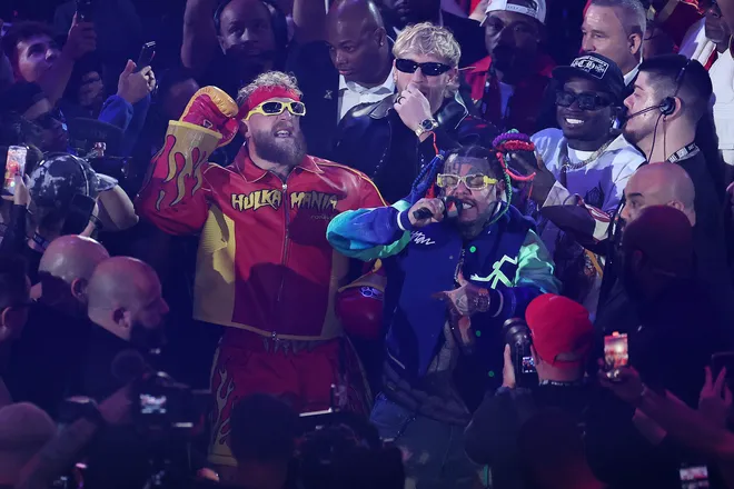 MIAMI, FLORIDA - DECEMBER 19: Jake Paul, Logan Paul, and 6ix9ine walk to the ring before i their heavyweight bout against Anthony Joshua in Jake Paul v Anthony Joshua at Kaseya Center on December 19, 2025 in Miami, Florida. (Photo by Carmen Mandato/Getty Images for Netflix)