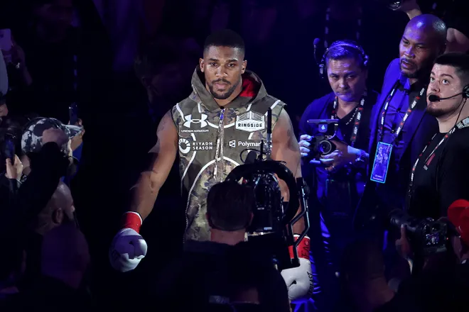 MIAMI, FLORIDA - DECEMBER 19: Anthony Joshua walks to the ring before his heavyweight bout against Jake Paul during Jake Paul v Anthony Joshua at Kaseya Center on December 19, 2025 in Miami, Florida. (Photo by Carmen Mandato/Getty Images for Netflix)