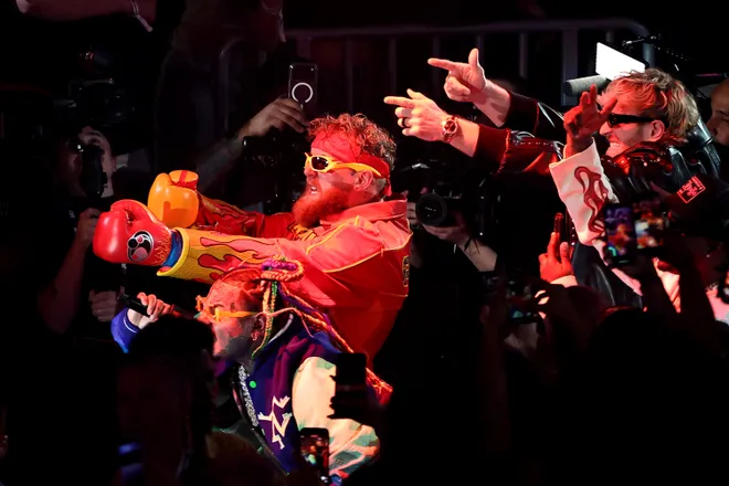MIAMI, FLORIDA - DECEMBER 19: Jake Paul, Logan Paul, and 6ix9ine walk to the ring before i their heavyweight bout against Anthony Joshua in Jake Paul v Anthony Joshua at Kaseya Center on December 19, 2025 in Miami, Florida. (Photo by Carmen Mandato/Getty Images for Netflix)