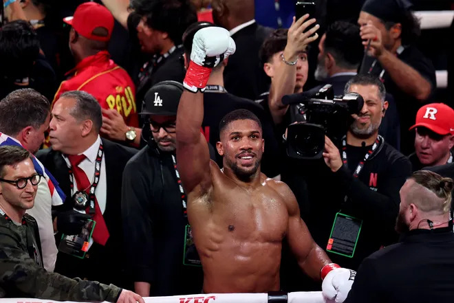 MIAMI, FLORIDA - DECEMBER 19: Anthony Joshua celebrates victory over Jake Paul in their heavyweight bout during Jake Paul v Anthony Joshua at Kaseya Center on December 19, 2025 in Miami, Florida. (Photo by Carmen Mandato/Getty Images for Netflix)