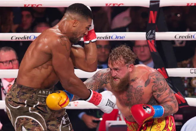 Dec 19, 2025; Miami, Florida, UNITED STATES; Jake Paul fights Anthony Joshua during a heavyweight boxing bout at Kayesa Center. Mandatory Credit: Sam Navarro-Imagn Images