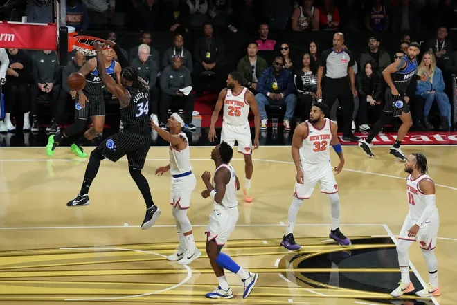 Dec 13, 2025; Las Vegas, Nevada, USA; Orlando Magic center Wendell Carter Jr. (34) goes up for he dunk against the New York Knicks during the first quarter at T-Mobile Arena.