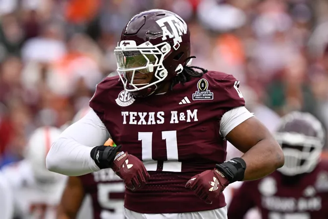 Dec 20, 2025; College Station, TX, USA; Texas A&M Aggies defensive tackle Tyler Onyedim (11) celebrates a sack during first half of the first round game of the CFP National Playoff against the Miami Hurricanes at Kyle Field. Mandatory Credit: Jerome Miron-Imagn Images