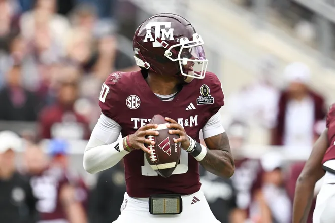 Dec 20, 2025; College Station, TX, USA; Texas A&M Aggies quarterback Marcel Reed (10) drops back to pass against the Miami Hurricanes during first half of the first round game of the CFP National Playoff at Kyle Field. Mandatory Credit: Maria Lysaker-Imagn Images