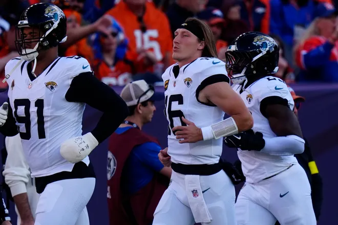 Dec 21, 2025; Denver, Colorado, USA; Jacksonville Jaguars quarterback Trevor Lawrence (16) before the game at Empower Field at Mile High. Mandatory Credit: Ron Chenoy-Imagn Images