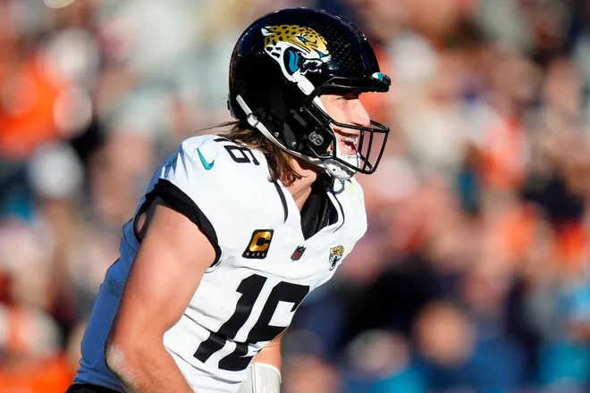 Dec 21, 2025; Denver, Colorado, USA; Jacksonville Jaguars quarterback Trevor Lawrence (16) during the first half at Empower Field at Mile High. Mandatory Credit: Ron Chenoy-Imagn Images