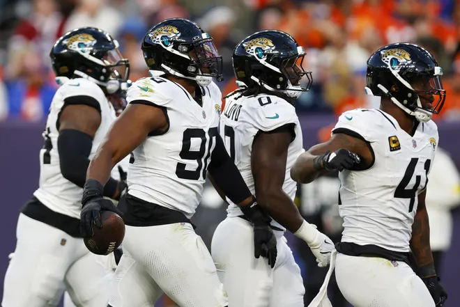 DENVER, COLORADO - DECEMBER 21: Emmanuel Ogbah #90 of the Jacksonville Jaguars celebrates after recovering a fumble during the third quarter at Empower Field At Mile High on December 21, 2025 in Denver, Colorado. (Photo by Justin Edmonds/Getty Images)