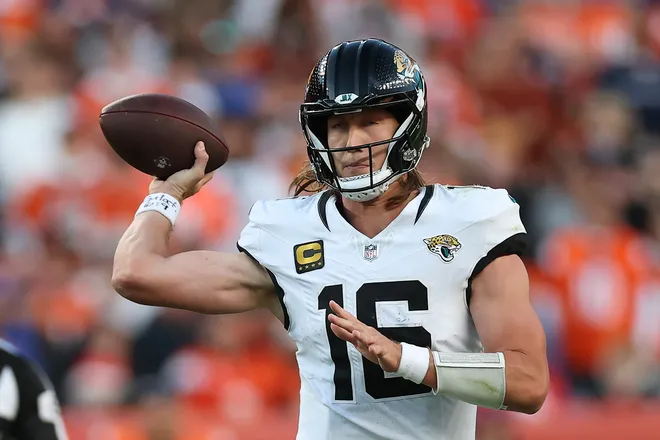 DENVER, COLORADO - DECEMBER 21: Trevor Lawrence #16 of the Jacksonville Jaguars throws a pass during the third quarter against the Denver Broncos at Empower Field At Mile High on December 21, 2025 in Denver, Colorado. (Photo by Matthew Stockman/Getty Images)