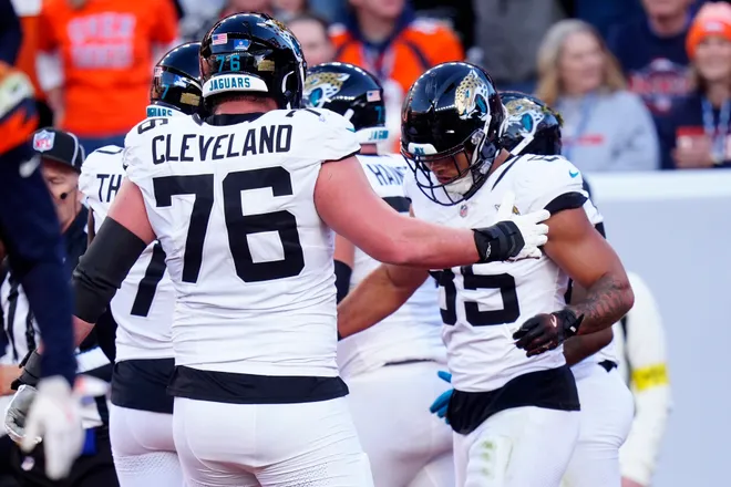 Dec 21, 2025; Denver, Colorado, USA; Jacksonville Jaguars tight end Brenton Strange (85) reacts after scoring a touchdown during the first half at Empower Field at Mile High. Mandatory Credit: Ron Chenoy-Imagn Images