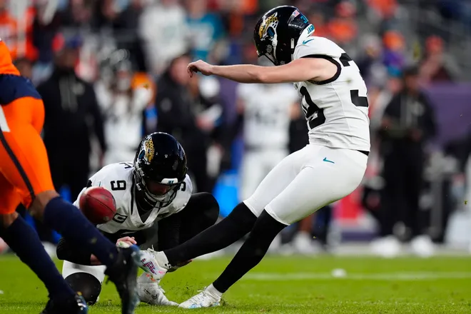 Dec 21, 2025; Denver, Colorado, USA; Jacksonville Jaguars kicker Cam Little (39) kicks a field goal against the Denver Broncos during the second half at Empower Field at Mile High. Mandatory Credit: Ron Chenoy-Imagn Images