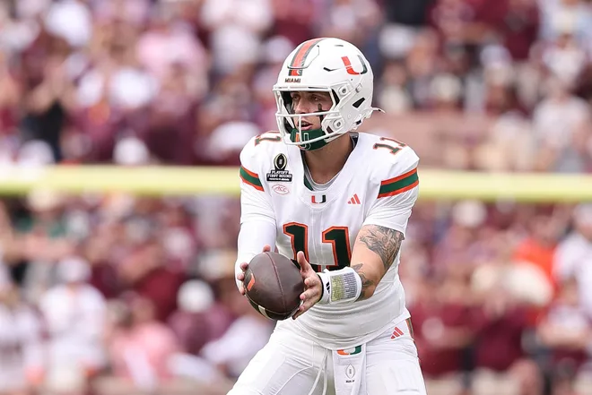Miami Hurricanes quarterback Carson Beck (11) takes the snap against the Texas A&M Aggies during the second half of the first round game of the college football playoff