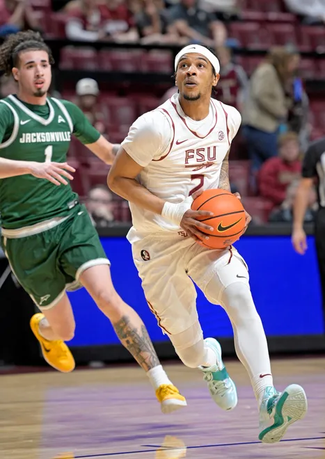 Dec 22, 2025; Tallahassee, Florida, USA; Florida State Seminoles guard Cam Miles (2) eyes the net during the first half against the Jacksonville University Dolphins at Donald L. Tucker Center. Mandatory Credit: Melina Myers-Imagn Images