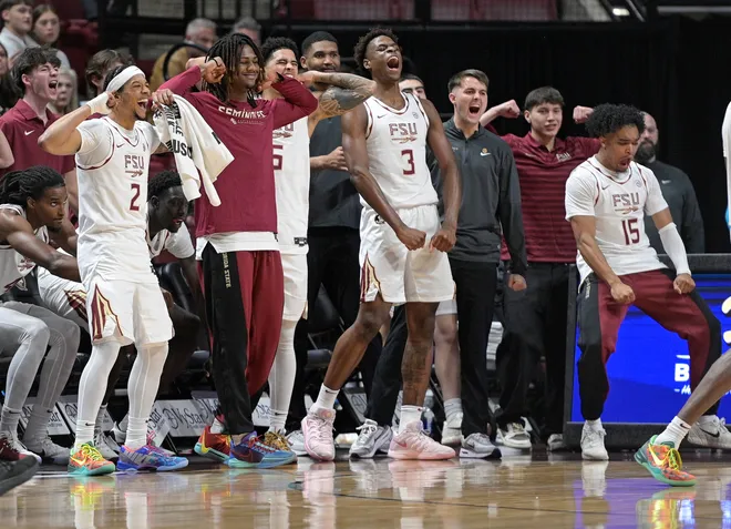 Dec 22, 2025; Tallahassee, Florida, USA; Florida State University bench players react to a play during the second half against the Jacksonville University Dolphins at Donald L. Tucker Center. Mandatory Credit: Melina Myers-Imagn Images