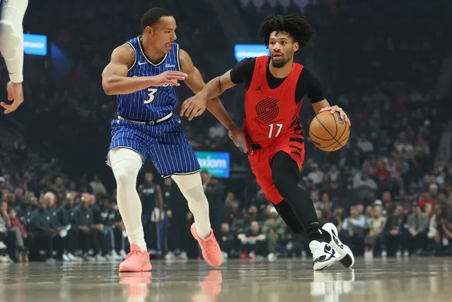 Dec 23, 2025; Portland, Oregon, USA; Portland Trail Blazers guard Shaedon Sharpe (17) dribbles the ball past Orlando Magic guard Desmond Bane (3) during the first half at Moda Center.