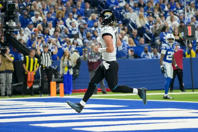 Jacksonville Jaguars quarterback Trevor Lawrence (16) runs in a touchdown Sunday, Dec. 28, 2025, during a game against the Indianapolis Colts at Lucas Oil Stadium in Indianapolis.