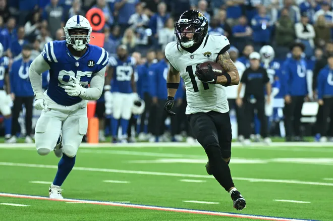 Dec 28, 2025; Indianapolis, Indiana, USA; Jacksonville Jaguars wide receiver Parker Washington (11) runs against Indianapolis Colts defensive tackle Adetomiwa Adebawore (95) during the second half at Lucas Oil Stadium. Mandatory Credit: Robert Goddin-Imagn Images