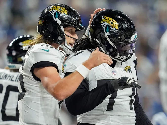 Dec 28, 2025; Indianapolis, Indiana, USA; Jacksonville Jaguars quarterback Trevor Lawrence (16) celebrates after running in a touchdown during a game against the Indianapolis Colt at Lucas Oil Stadium. Mandatory Credit: Mykal McEldowney-USA TODAY Network via Imagn Images