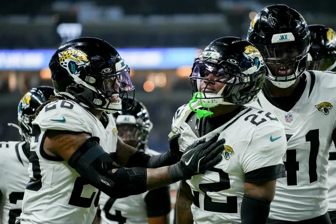 Dec 28, 2025; Indianapolis, Indiana, USA; Jacksonville Jaguars cornerback Jarrian Jones (22) celebrates with his teammates after making an interception during a game against the Indianapolis Colts at Lucas Oil Stadium. Mandatory Credit: Mykal McEldowney-USA TODAY Network via Imagn Images