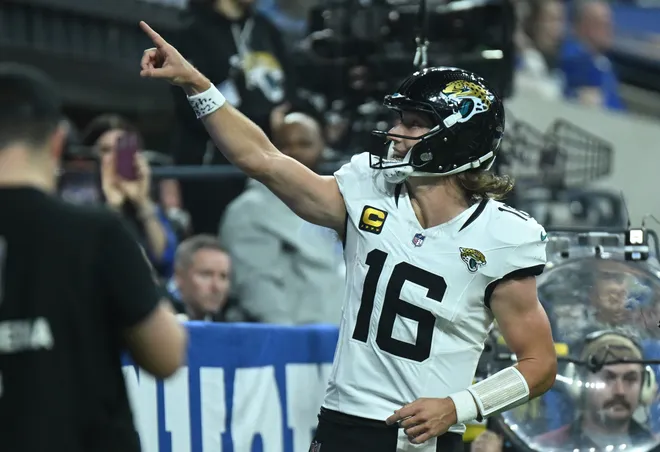 Dec 28, 2025; Indianapolis, Indiana, USA; Jacksonville Jaguars quarterback Trevor Lawrence (16) reacts after a touchdown during the second half against the Indianapolis Colts at Lucas Oil Stadium. Mandatory Credit: Robert Goddin-Imagn Images