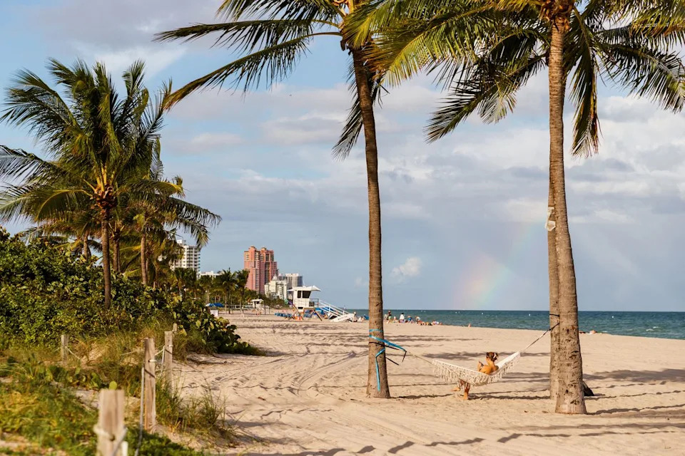 Adrian Rudd/Travel + Leisure A hammock hung between two palm trees on a Fort Lauderdale beach.