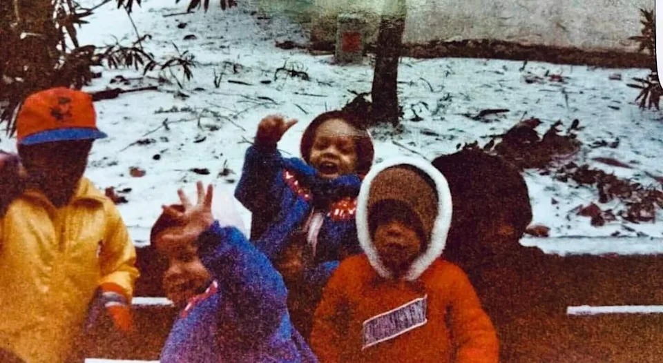 Chance Rutherford says he's the child raising a high five in the front.