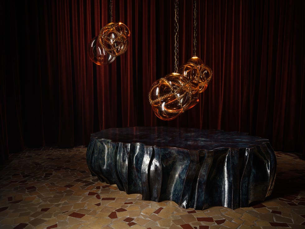 Sculptural table with pendant lights Sculptural table with pendant lights