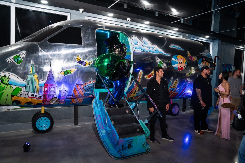 Photo of a plane covered in graffiti.  