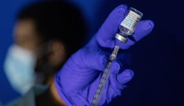 FILE - Family nurse practitioner Carol Ramsubhag-Carela prepares a syringe with the Mpox vaccine before inoculating a patient at a vaccinations site on Tuesday, Aug. 30, 2022, in the Brooklyn borough of New York. Africa's public health body said Thursday, Feb. 16, 2023 it hopes Mpox vaccines will finally arrive on the continent "in another two weeks, tops" after months of seeking doses. (AP Photo/Jeenah Moon, File)