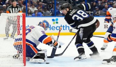 New York Islanders goaltender Ilya Sorokin (30) stops a shot by Tampa Bay Lightning left wing Brandon Hagel (38) during the second period of an NHL hockey game Saturday, Dec. 6, 2025, in Tampa, Fla. (AP Photo/Chris O'Meara)