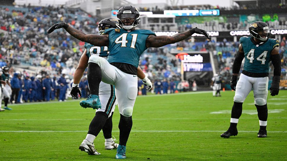Jacksonville Jaguars defensive end Josh Hines-Allen (41) celebrates after getting a safety against the Indianapolis Colts during the second half of an NFL football game, Sunday, Dec. 7, 2025, in Jacksonville, Fla. (AP Photo/Phelan M. Ebenhack)