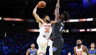 New York Knocks center Karl-Anthony Towns (32) and Orlando Magic forward Jonathan Isaac (1) tangle near the net during the first half of an NBA Cup semifinals basketball game, Saturday, Dec. 13, 2025, in Las Vegas. (AP Photo/Ronda Churchill)