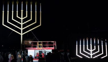 People look at the Menorah during the annual National Menorah Lighting in celebration of Hanukkah, on the Ellipse near the White House in Washington, Sunday, Dec. 14, 2025. (AP Photo/Jose Luis Magana)