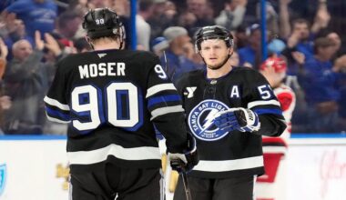 Tampa Bay Lightning center Jake Guentzel (59) celebrates his goal against the Carolina Hurricanes with defenseman J.J. Moser (90) during the third period of an NHL hockey game Saturday, Dec. 20, 2025, in Tampa, Fla. (AP Photo/Chris O'Meara)