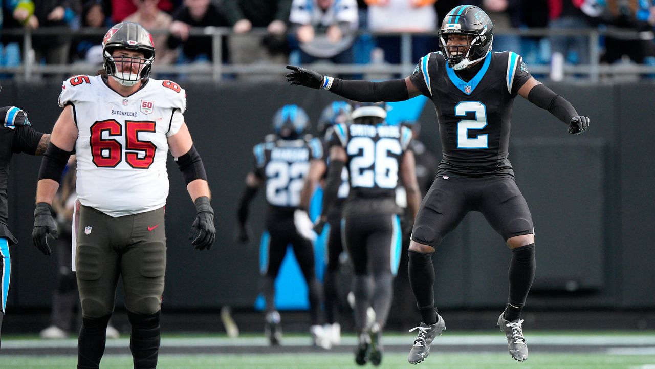 Carolina Panthers cornerback Mike Jackson celebrates after Carolina Panthers safety Lathan Ransom interception against the Tampa Bay Buccaneers during the second half of an NFL football game, Sunday, Dec. 21, 2025, in Charlotte, N.C. (AP Photo/Jacob Kupferman)