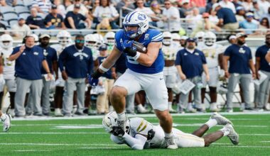 BYU tight end Carsen Ryan (20) is tackled by a Georgia Tech defensive player during the first half of the Pop-Tarts Bowl NCAA college football game Saturday, Dec. 27, 2025, in Orlando, Fla. (AP Photo/Kevin Kolczynski)