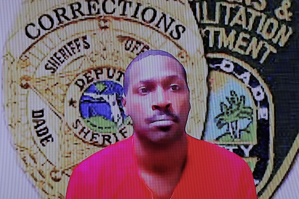 Former NFL star wide receiver Antonio Brown, displayed on a monitor, appears for his bond hearing via video, Wednesday, Nov. 12, 2025, in Miami. 