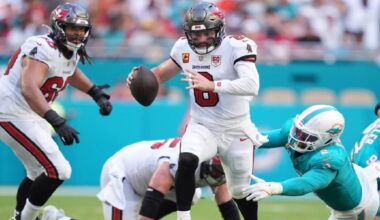 Tampa Bay quarterback Baker Mayfield runs to avoid Dolphins linebacker Bradley Chubb during Miami's 20-17 win Sunday. (AP Photo/Rebecca Blackwell)