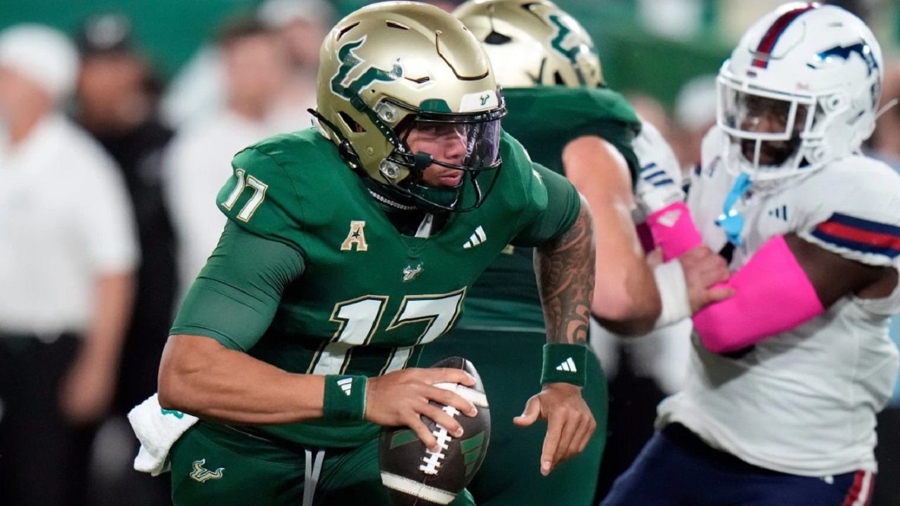 USF quarterback Byrum Brown scrambles for yardage during the Bulls' win against FAU Oct. 18 in Tampa. (AP Photo/Chris O'Meara)