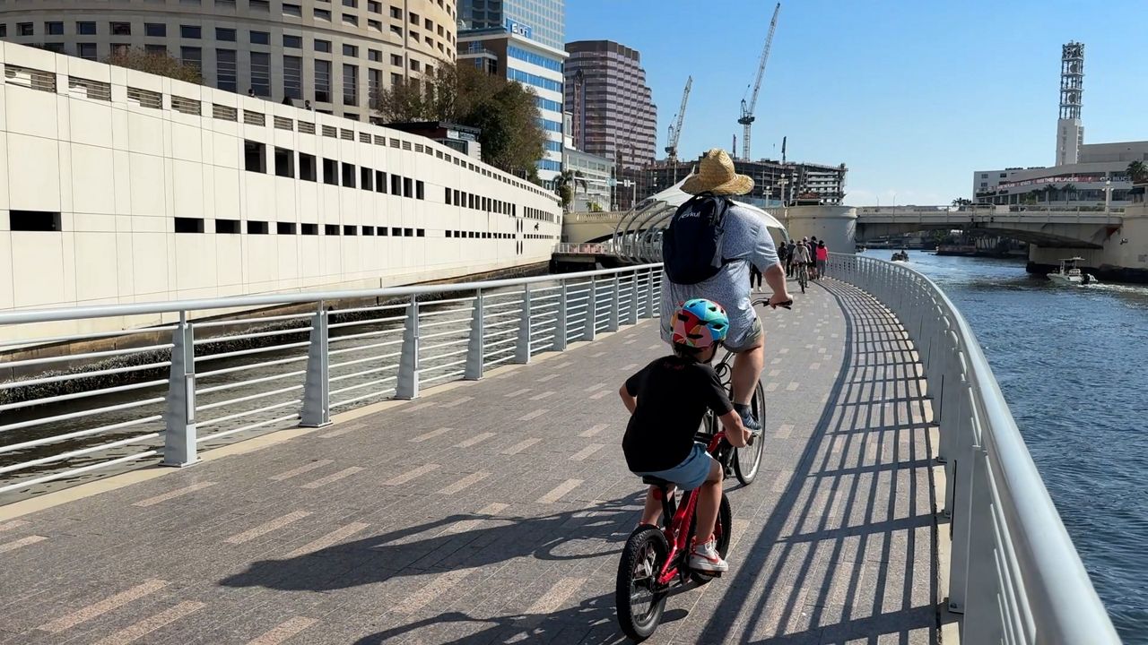Bikers at Tampa Riverwalk. (Spectrum News)