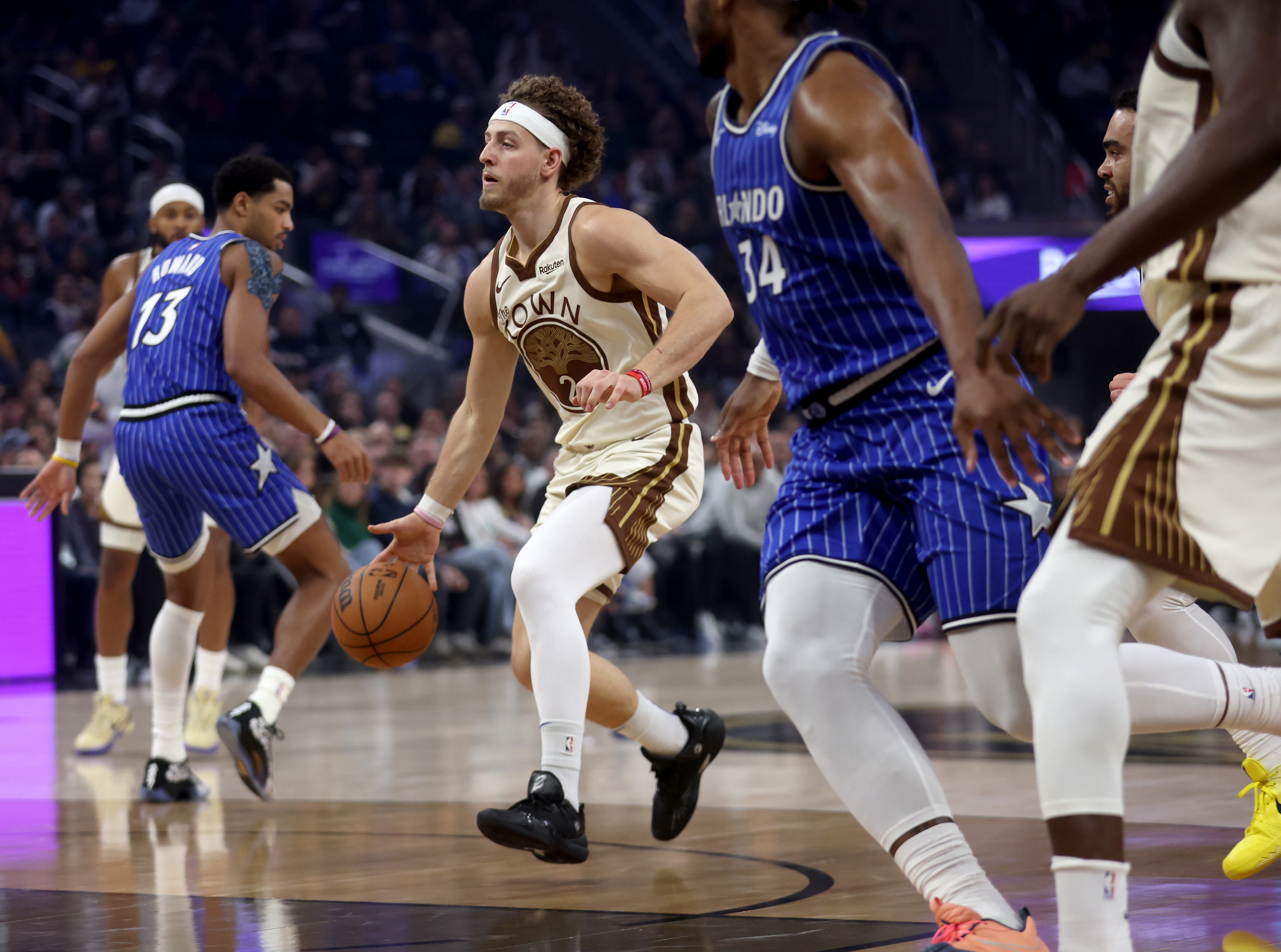 Golden State Warriors’ Brandin Podziemski #2 brings the ball down...