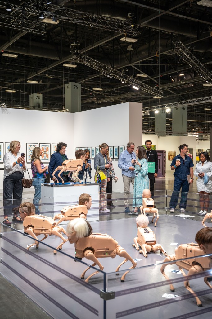 Beeple's "Regular Animals" featuring flesh-colored robot dogs with realistic masks of billionaires.