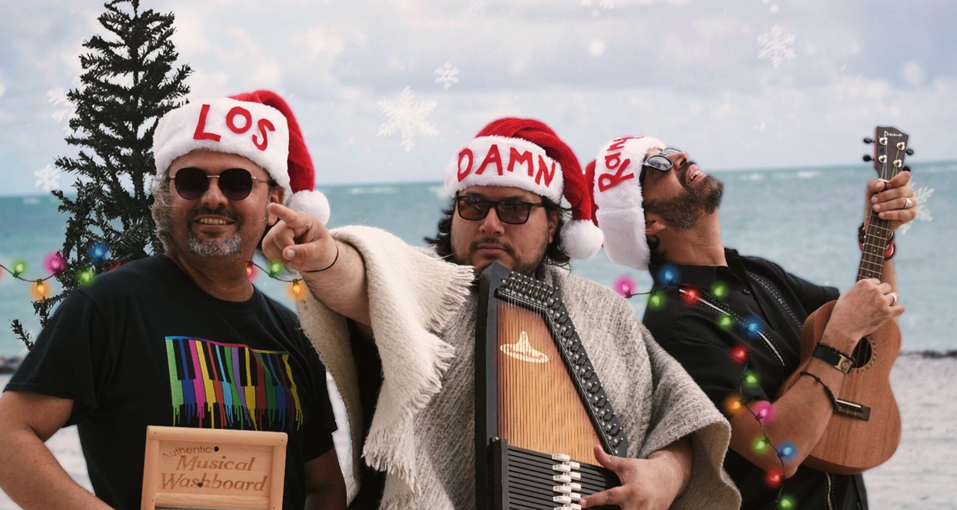 Photo of men wearing christmas hats at the beach.