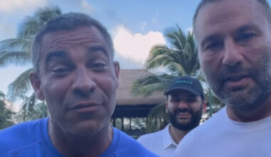 Francis Suarez (left) speaks to the camera and David Grutman in a white shirt stands to his right looking at the camera. In between the two of them but feet behind them is Rafael Ilishayev who is wearing a white polo shirt and a green "Moskito" hat. He also has a dark brown beard.